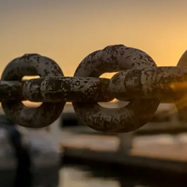 selective focus photoraphy of chains during golden hour